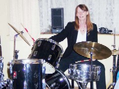 Liz Alderson on drums practising at home