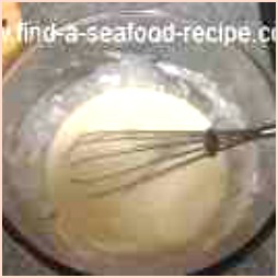 Whisking batter mixture with a balloon whisk