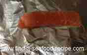 wrapping salmon in foil ready for cooking
