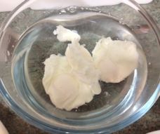three poached eggs in cold water three poached eggs in cold water