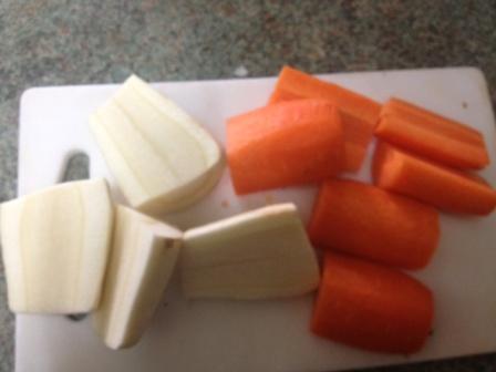 peeled and cut carrots and parsnips ready for roasting peeled and cut carrots and parsnips ready for roasting